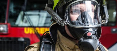 Fireman with breathing mask close up